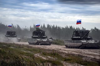 Russian tanks move during the